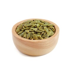 Pumpkin seeds in wooden bowls close up on white background.