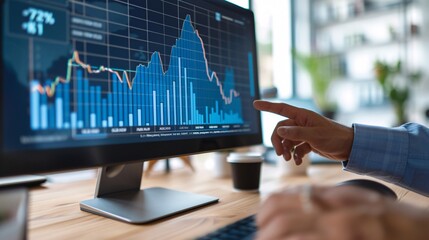 Analyst Pointing Towards Graph on Computer Screen to Explain Trend