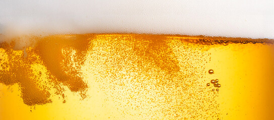Obraz premium macro photography foamy beer with gas bubbles. Background closeup with space for text