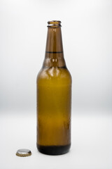 A bottle, a mug with light beer.
