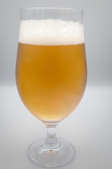 Glass of beer on a white background.
