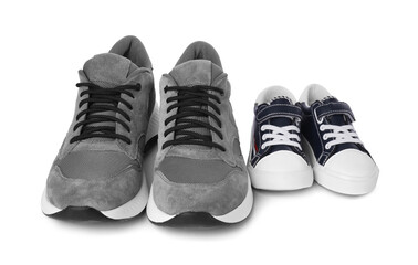 Big and small sneakers isolated on white