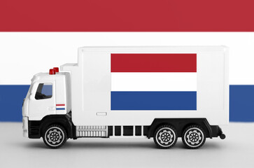 Netherlands flag depicted on side wall of white delivery van close up. Shipping and local delivery concept