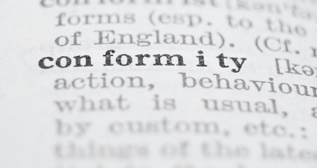 Conformity definition in the dictionary close-up, shallow depth of field and selective focus.