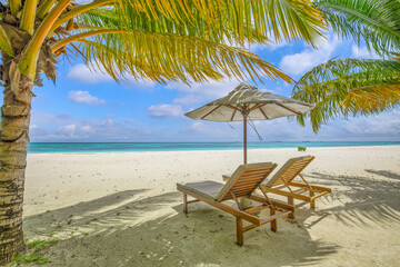 Beautiful panoramic sea sand sky. Tropical relax beach sunny summer island landscape. Love couple chairs umbrella palm leaves romantic coast. Luxury travel destination. Honeymoon vacation best tourism