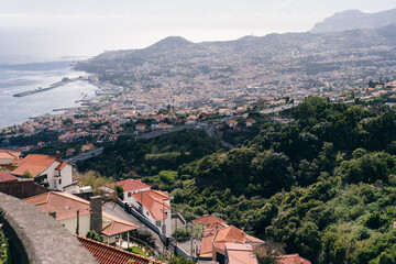 Fototapeta premium Funchal city of Madeira island Portugal with fortress on the coast of Atlantic Ocean. Aerial view