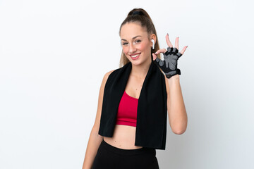 Young sport caucasian woman isolated on white background showing ok sign with fingers