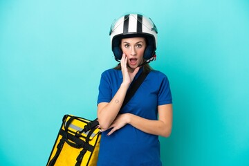 Young caucasian woman with thermal backpack isolated on white background surprised and shocked while looking right
