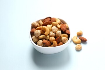 Mixed nuts on colored background