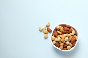 Mixed nuts on colored background