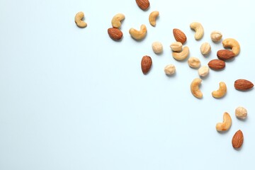 Mixed nuts on colored background