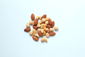 Mixed nuts on colored background