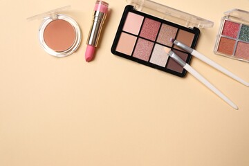 Professional decorative cosmetics, make-up products and accessories on color background, minimal style