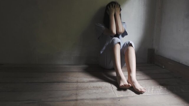 Young depressed woman in trouble pulling her face with hands and crying sitting on Wooden bed. Slow motion shot
