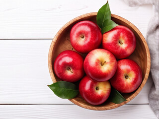 Top view of Fresh red apples. Close up of fresh red apples on wooden bowl on white wooden background. Copy space.