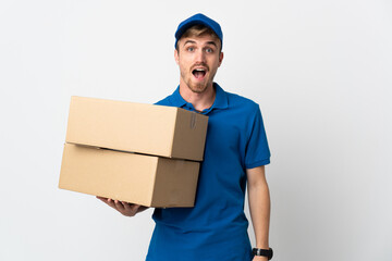 Young delivery blonde man isolated on white background with surprise facial expression