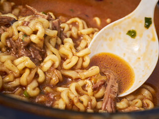 Birria ramen, a contemporary Mexican/Asian fusion dish from the Corona Plaza Market in Queens, New York