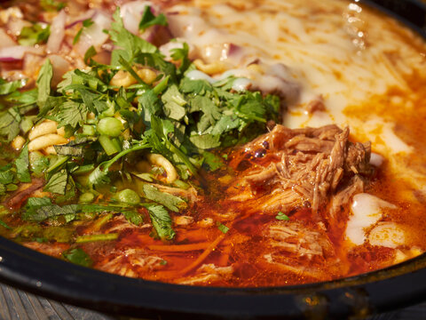 Birria ramen, a contemporary Mexican/Asian fusion dish from the Corona Plaza Market in Queens, New York