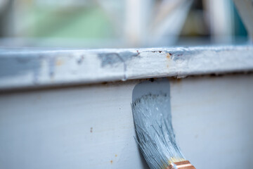 Anti-rust primer brush, on the rusty metal panel