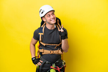 Young rock climber Brazilian man pointing up a great idea