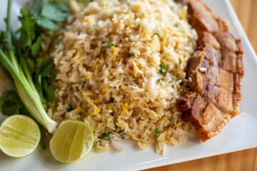 Fried rice with crispy pork served on plate