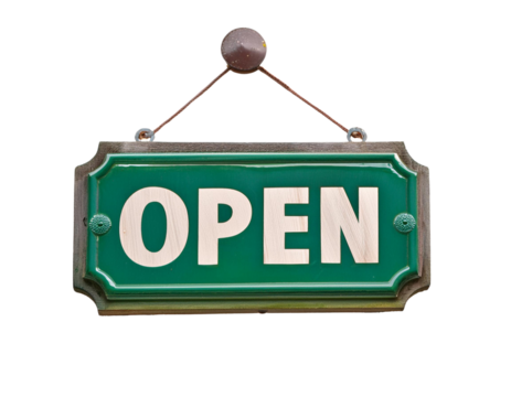 A classic green wooden open sign hanging from a chain, inviting customers into a business or store.