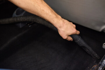 Car interior cleaning includes thorough cleaning under pedals for a tidy interior