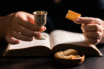 Sacred ceremony of Communion, Christians express their faith by partaking in holy bread, deepening their spiritual connection with God within the church. communion, religion, christian, faith, holy.