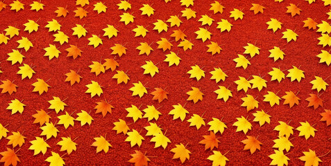 Colorful seasonal autumn background pattern, Vibrant carpet of fallen forest red, orange and yellow leaves.