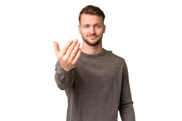 Naklejka premium Young handsome caucasian man over isolated chroma key background inviting to come with hand. Happy that you came