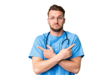 Young nurse man over isolated chroma key background pointing to the laterals having doubts