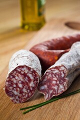 Close-Up 4K image of Slicing Very Thin Salami Sausage for Charcuterie
