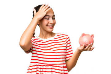 Young Arab woman holding a piggybank over isolated background has realized something and intending the solution