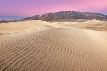 Landscape at sunrise of the Mesquite Flat Sand Dunes and Panamint Mountains, Death Valley National...
