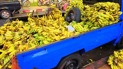 Banana selling at the wet market in Bogor city, west Java in Asia street market fruit vendor,...