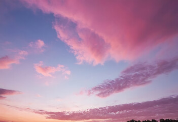 A mesmerizing sunset sky painted in vibrant hues of pink, orange, and blue, perfect for backgrounds, designs, social media, or nature-themed projects