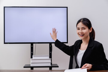 Studying from home concept, young woman watching lesson online on digital screen with video conference.