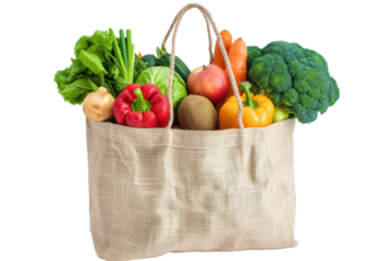 Reusable grocery bag containing fresh fruits and vegetables isolated on white background.