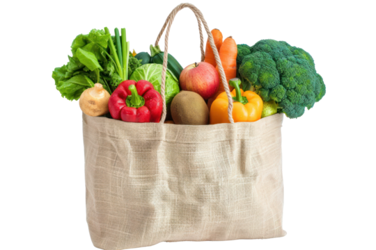 Reusable grocery bag containing fresh fruits and vegetables isolated on white background.