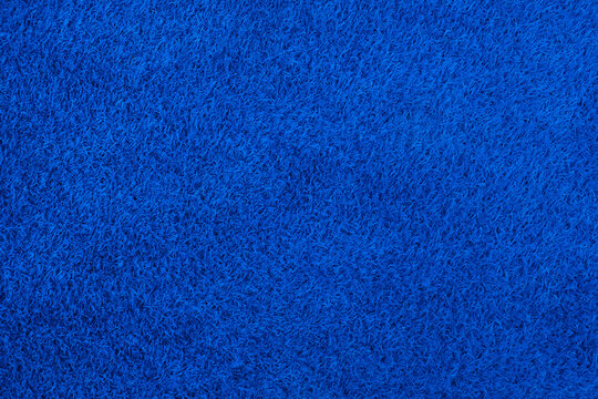 Artificial blue grass, playground surface, top view. Empty space, design element.