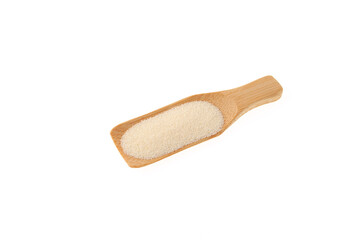 Semolina powder in wooden scoop on white background.