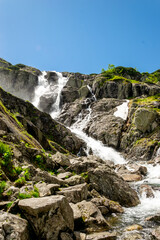 Mountain landscape with waterfall in Tatra Mountains, Poland. The largest waterfall in Poland, Wielka Siklawa. The world of beauty.