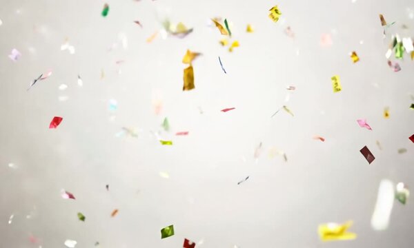 A Rain of Celebration: Colorful confetti explodes against a clean white backdrop, capturing the joyous spirit of a festive occasion. 