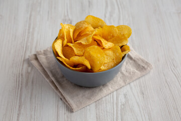 Bacon Flavored Potato Chips in a Bowl, side view.