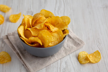 Bacon Flavored Potato Chips in a Bowl, low angle view. 