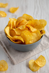 Bacon Flavored Potato Chips in a Bowl, side view.