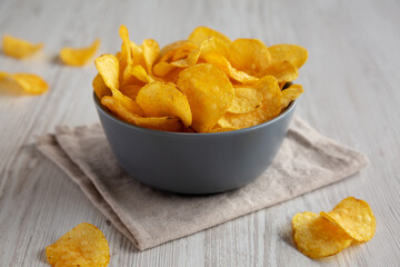 Bacon Flavored Potato Chips in a Bowl, low angle view.