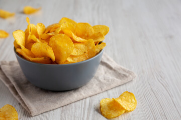 Bacon Flavored Potato Chips in a Bowl, low angle view. Copy space.