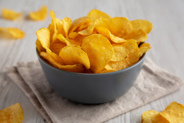 Bacon Flavored Potato Chips in a Bowl, low angle view. Close-up.