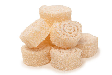 Coconut candy roll isolated on a white background.
